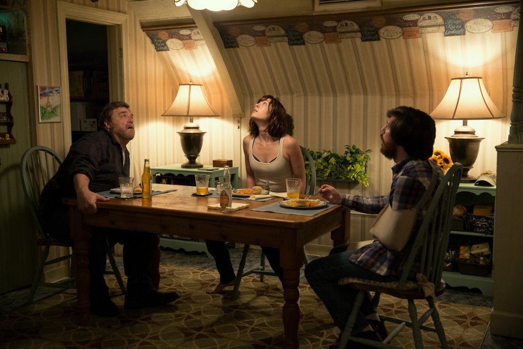 (L-R) John Goodman as Howard, Mary Elizabeth Winstead as Michelle, and John Gallagher Jr. as Emmett in 10 CLOVERFIELD LANE, by Paramount Pictures